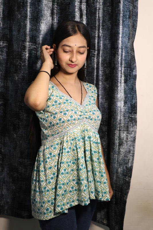 Model wearing Khilan Collection floral printed cotton short kurti with W-neck and lace detail – front view