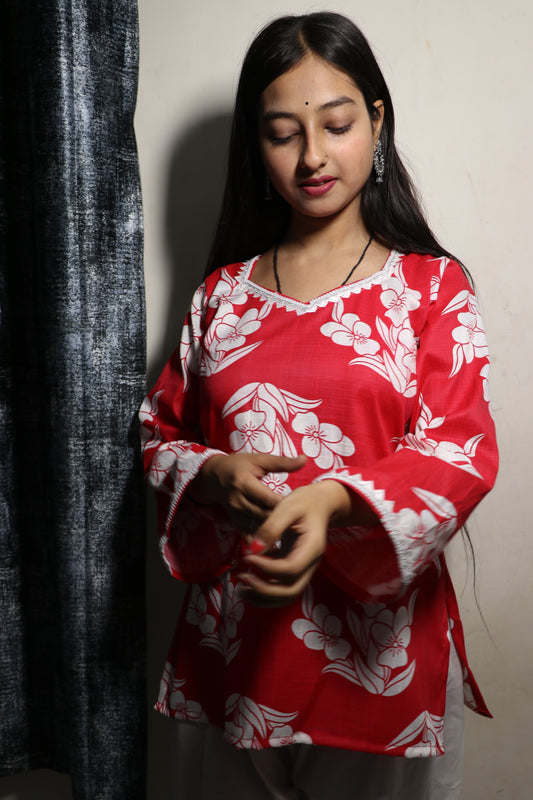 Model in Khilan Collection red floral short kurti with lace-trimmed V-neck and flared sleeves – side pose