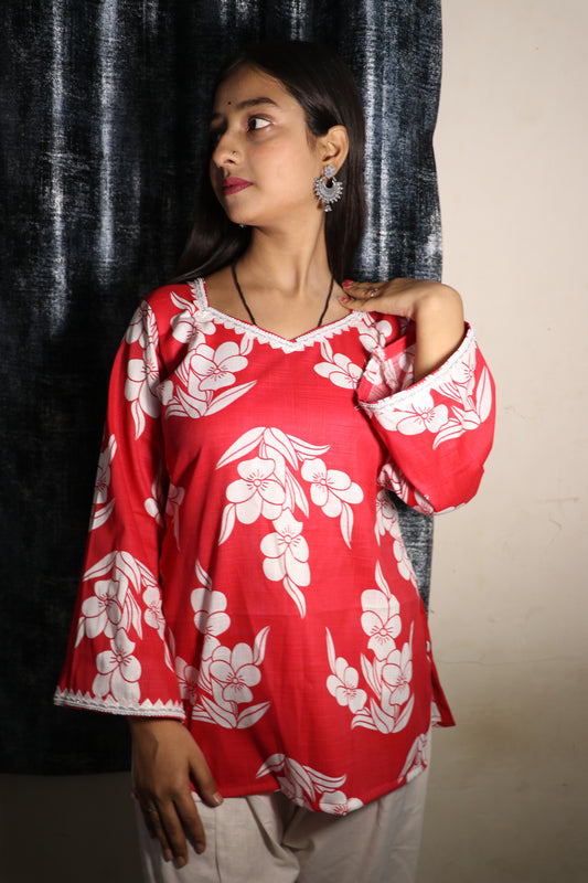 Model in Khilan Collection red floral short kurti with lace-trimmed V-neck and flared sleeves